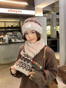 Close-up of Fair Isle knit beanie and scarf set featuring vintage Nordic jacquard patterns