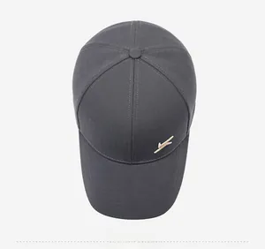 Top view of dark grey baseball cap showing twill fabric and side gold logo detail