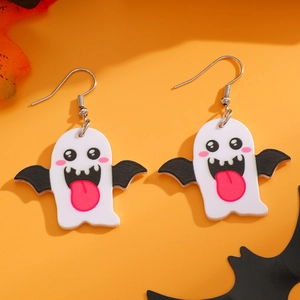 Detail of cute acrylic Halloween ghost earrings with bat wings on orange background
