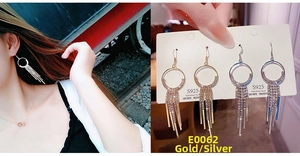 Detail of S925 silver needle tassel earrings with rhinestones in gold and silver finish