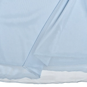 Detailed close-up of light blue mesh fabric with fine net texture and lettuce hem edge