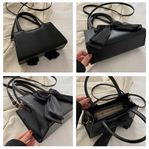 Detail view of black handbag with bow, showing four angles and interior compartments
