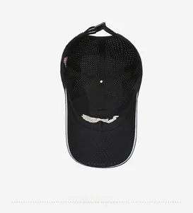 Internal view of black mesh baseball cap showing breathable holes and adjustable strap
