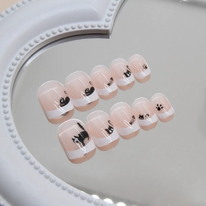 Short square press-on nails featuring black cat cartoon designs and French tips