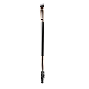 Detail of dual-ended eyebrow brush with angled bristles and spoolie on pink wooden handle