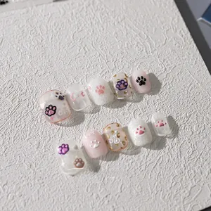 Detail view of 3D embossed cat paw nail stickers with glitter and Cat lettering