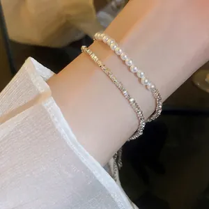 Double-layer pearl and silver bead bracelet set for women worn on wrist for an elegant look