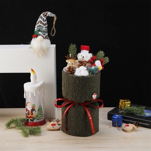 Christmas bouquet with plush bear and deer inside green socks with red merry ribbon