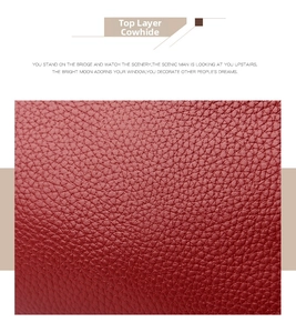 Detailed macro shot of deep red top layer cowhide leather with natural lychee grain