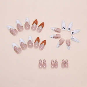 Detail showing 3D pink flower accents and sparkling rhinestones on press on nails