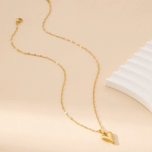 Elegant gold stainless steel necklace with 3D heart pendant on a minimalist chain