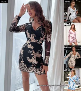 Detailed close-up showing intricate floral sequin patterns on a long sleeve V-neck dress