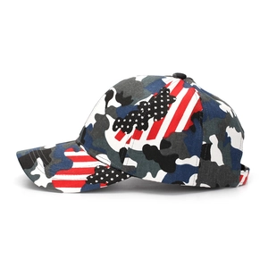 Side view of camouflage baseball cap with US flag embroidery and curved brim detail