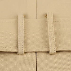 Detailed view of the waist structure and khaki twill cotton fabric with belt loops