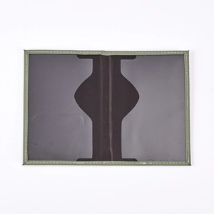 Detailed interior of the PU leather passport holder showing clear slot and green trim