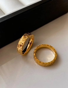 Detail of 18k gold plated ring with hammered texture surface and polished inner band
