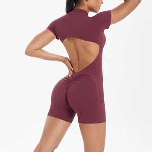 Close-up of the deep red yoga bodysuit featuring back cutout and scrunch butt detail