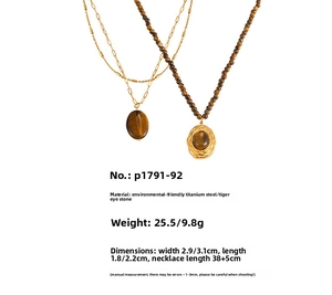Detail view of retro tiger eye stone necklaces made of gold-plated titanium steel