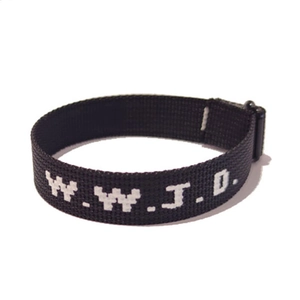 Detail of woven fabric wristband featuring white WWJD letters and a black plastic buckle