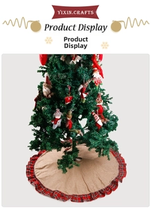 Detail of jute Christmas tree skirt with red plaid ruffle and festive plush ornaments
