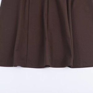Deep brown long-sleeve dress featuring high-quality twill fabric and textured hem detail