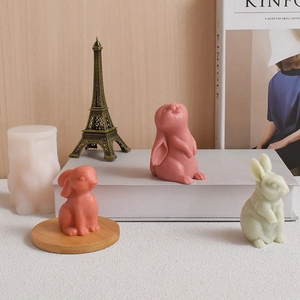 Detailed 3D rabbit silicone mold next to cute finished Easter bunnies with fur texture