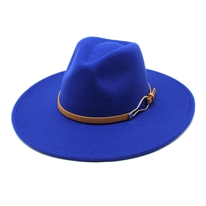 Detailed shot of blue wool jazz hat featuring a brown leather band and metal buckle