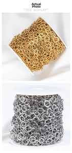 Detail of gold and silver stainless steel flat O-chains on rolls for DIY jewelry making