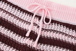 Close-up of pink and brown striped knitted shorts with adjustable drawstring waist