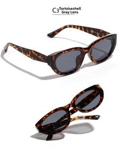 Detailed view of tortoiseshell cat-eye sunglasses with grey lenses and rivet accents