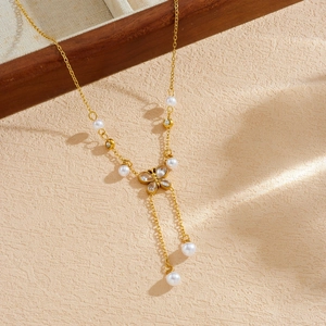 Elegant gold butterfly pearl necklace with tassel pendant and zircon stones
