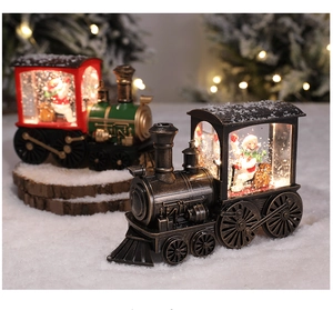 Macro shot of retro Christmas train lantern featuring built-in LED warm light and snow globe