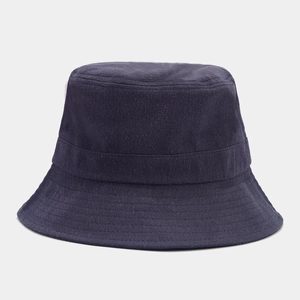 Close-up of navy blue canvas bucket hat showing reinforced brim stitching and durable texture