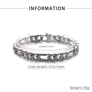 Detail of flat Cuban chain bracelet in stainless steel with vintage carved patterns