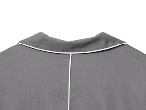 Detail view of dark grey poplin shirt collar with white trim and premium stitching