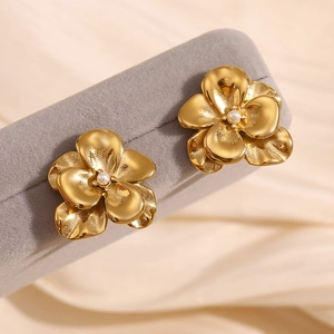 Detailed macro view of 18K gold double layer petal earrings with small white pearls