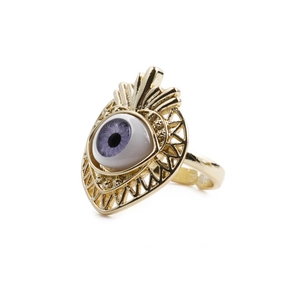 Gold plated ring featuring a purple and white cubic zirconia Maya's eye design on white base
