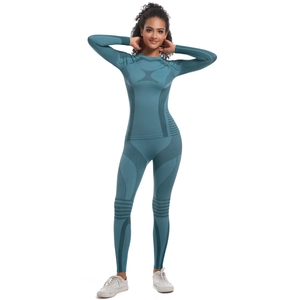 Macro detail of seamless knit texture and breathable mesh on cyan blue athletic set