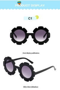 Close-up of flower shaped kids sunglasses with purple gradient lenses and black frames