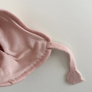 Pink knitted baby winter hat with soft lining and jacquard chick earflaps design