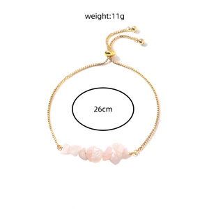 Detail of adjustable gold chain bracelet with natural pink crystal stones and size specs