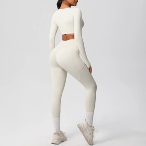 Rear view of cream-colored seamless yoga set showing high waist leggings and crop top