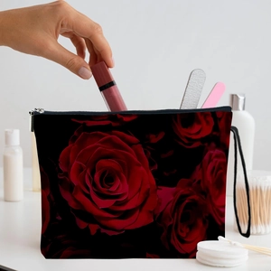 Portable black makeup bag with red rose pattern and handle for cosmetic storage