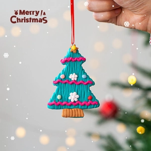Handmade clay Christmas tree pendant with colorful ornaments and a red hanging string