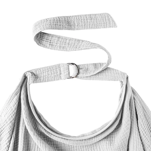 Detail of adjustable metal D-ring buckle and grey crinkle cotton fabric on nursing cover