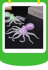 Detail of purple and green squeeze octopus toys with bead filling on a black surface