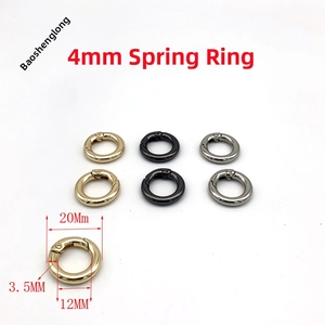 Detailed view of 20mm O-ring spring clasps in gold black and silver metal finishes