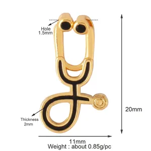 Golden stethoscope pendant with black enamel detailing for DIY jewelry making