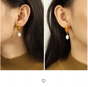 Detailed view of 18K gold plated hoop earrings with elegant freshwater pearl drops