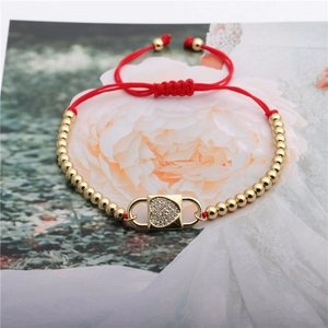 Adjustable red rope bracelet with golden heart lock pendant and zircon stones
